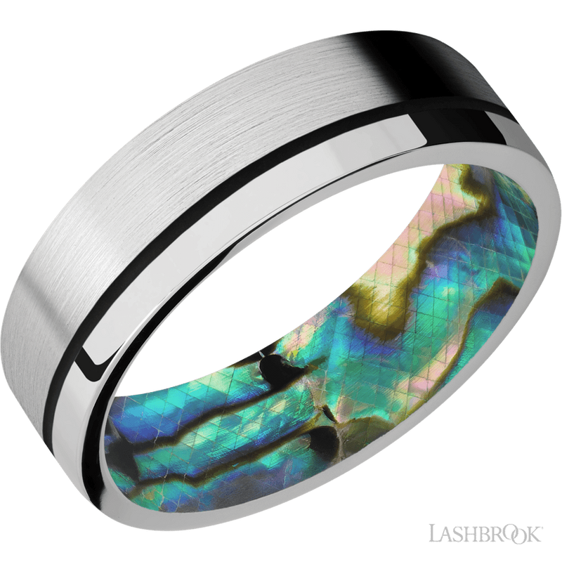 7 mm wide/Flat/14K White Gold band with one 0.5 mm Off Center inlay of Black also featuring a Abalone sleeve.