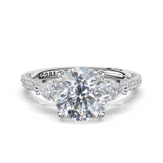3-Stone Pear Diamond Side Round Engagement Ring in Platinum