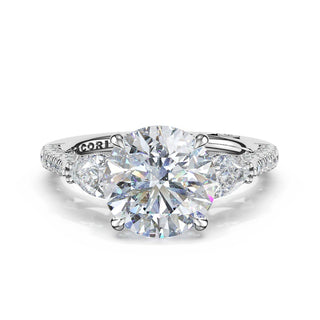 3-Stone Pear Diamond Side Round Engagement Ring in Platinum