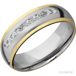 7 mm wide/Domed Stepped Down Edges/Cobalt Chrome band with an  arrangement of 9, .05 carat Round Lab Grown Diamond stones in a Channel setting and featuring two 1 mm Edge inlays of 14K Yellow Gold