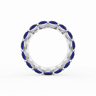 Round Cut Blue Sapphire Eternity Band in 18kt White Gold