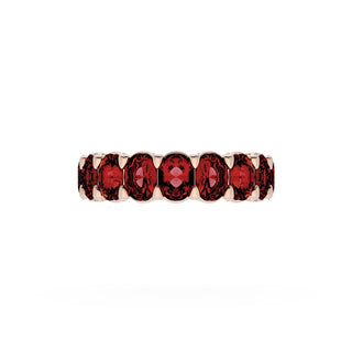 Oval Cut Ruby Eternity Band in 18kt Rose Gold