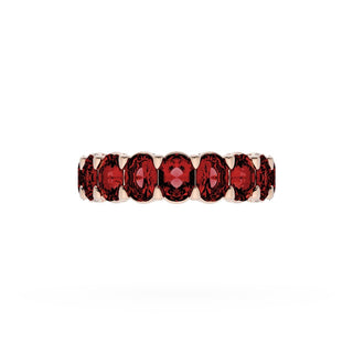 Oval Cut Ruby Eternity Band in 18kt Rose Gold