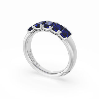 Emerald Cut Blue Sapphire Eternity Band in 18kt White Gold