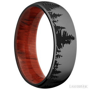 7 mm wide/Domed/Zirconium band with a laser carved Trees pattern also featuring a Padauk sleeve.