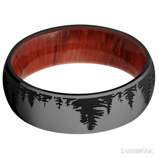 7 mm wide/Domed/Zirconium band with a laser carved Trees pattern also featuring a Padauk sleeve.