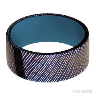 9 mm wide Flat Titanium Damascus band featuring a Royal Blue sleeve.