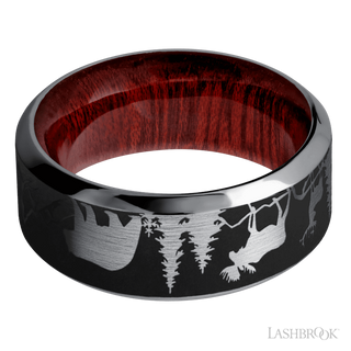 9 mm wide/High Bevel/Tantalum band with a laser carved Bear Moose Deer Mountain pattern also featuring a Blood Wood sleeve.