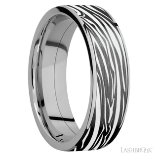 7 mm wide/Flat/Titanium band with one 6 mm Centered inlay of Zirconium with a laser carved Zebra pattern.