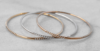Three gold and silver bangles