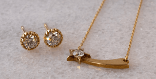 Gold jewelry set with earrings and a necklace